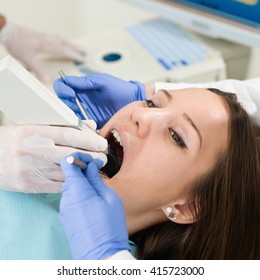 Dentist Using Intraoral Camera To Create Tooth Model