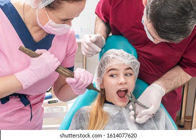 Dentist Wants To Pull Out Teeth To A Frightened Patient With Pliers