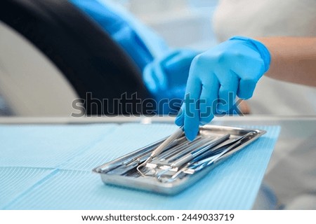 Dentist at workplace using sterile instruments