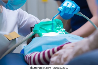 Dentistry. Little Girl Getting Inhalation Sedation While Teeth Treatment At Dental Clinic. Teeth Treatment Child.