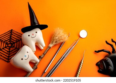 dentistry.dental.halloween. holiday concept. holidays. dentist.character for dentist halloween card.dental concept. figurines of teeth in halloween costumes and dental instruments. pumpkins and broom - Shutterstock ID 2202519105