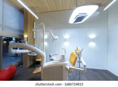 Dentist's Office. Children Dental Chair And Modern Equipment, No People, Copy Space