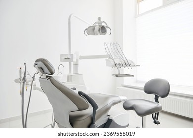 Dentist's office interior with modern chair and special dentisd equipment