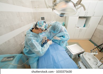 Dentists with a patient and assistant during a dental intervention. Dentist Concept. dental surgery. operation process
