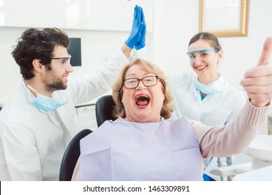 Dentists And Patient In Surgery Being A Bit Over The Top Excited Giving High Five