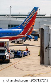 Denver Airport Colorado USA; June 3, 2021 A Baggage Handler Waits For An Incoming Plane