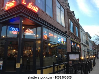 Denver, CO, USA - 12 November 2017: Facade Of The Capitol Grill, An Upscale Steakhouse Chain In The Central Business District Of Denver, Colorado. Tables And Chairs Set Out For Outdoor Dining.