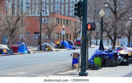 Denver, CO, USA, April 19, 2020. Unidentified homeless people camping out and living on the streets in Downtown Denver because the homeless shelters are no longer safe due to the Coronavirus. 
