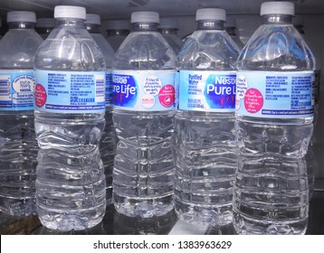 Denver, CO, USA, April 23, 2019. Bottles Of Nestle Pure Life Water Cooling Off In The Refrigerator. 