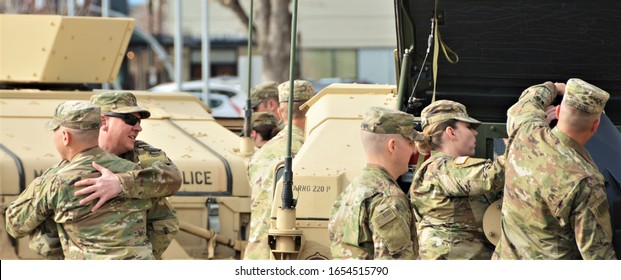 Denver, CO, USA. Feb 22, 2020. Unidentified Colorado National Guard Military Police Unit, U.S. Army Soldiers At A Going Away Ceremony Before They Deploy Overseas For 6 Months. 
