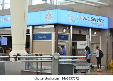 Denver, CO, USA. July 27, 2019. People  In Line For The ATM Machine At The Public Service Credit Union At Denver International Airport. The Bank Recently Changed Their Name To Canvas Credit Union. 