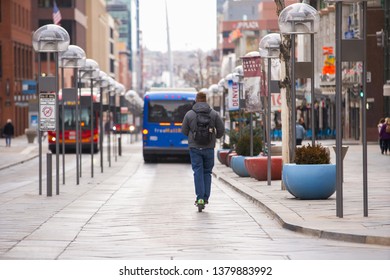 DENVER, CO, USA - MARCH 15, 2019: Man Riding A Rideshare Scooter At Downtown Denver CO