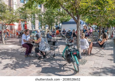 Denver, Colorado - August 28, 2021: People enjoy the farmers market at Union Station in the summer, downtown, in the LoDo (Lower Downtown) neighborhood.