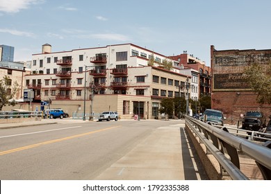 Denver, Colorado - August 4th, 2020:  Ghost Signs On Red Brick Commercial Buildings In The Riverfront Park Neighborhood Of Downtown Denver. 