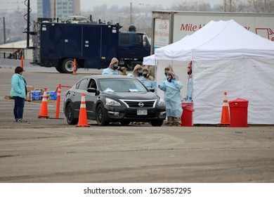 DENVER, COLORADO - MARCH 14, 2020: People Come To The Coronavirus Testing Site At Denver Coliseum