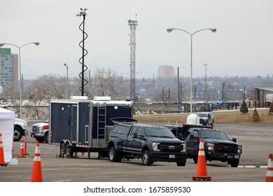 DENVER, COLORADO - MARCH 14, 2020: U.S. Federal Special Services' Vehicles By Drive-Through Coronavirus Testing Site At Denver Coliseum