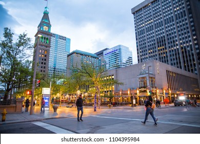 DENVER, COLORADO - MAY 1, 2018:  Street scene along the 16th Street Mall in downtown Denver Colorado at night with lights and people in view