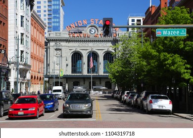 Denver, Colorado May 10, 2018:  Automobiles at a traffic red light in front of Union Station on Wazee Street in downtown Denver, Colorado