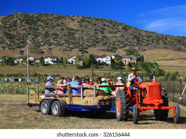 DENVER, COLORADO - October 10, 2015 - Families On A Hayride At A Fall Festival