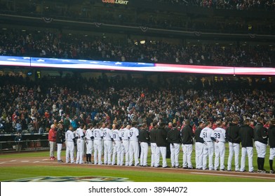 DENVER, COLORADO - OCTOBER 11:   The Colorado Rockies Listen To The National Anthem Prior To Game 3 Of The National League Division Series On October 11, 2009 In Denver Colorado.