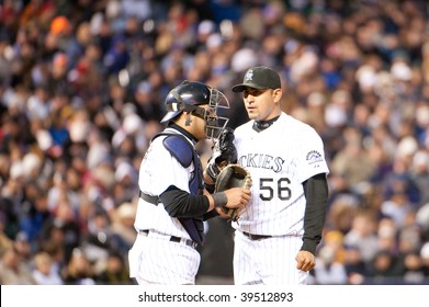 DENVER, COLORADO - OCTOBER 12: Franklin Morales And Yorvit Torrealba Of The Rockies Meet At The Mound In The National League Division Series On October 12, 2009 In Denver Colorado.