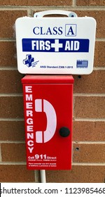 Denver, Colorado / United States - June 28. 2018:  Emergency Phone And Class A First Aid Kit Mounted At Apartment Swimming Pool