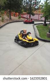 Denver Colorado USA - August 13, 2013.  Young Children Racing In Go Karts On A Figure Eight Track.  