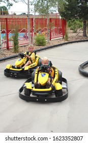 Denver Colorado USA - August 13, 2013.  Young Children Racing In Go Karts On A Figure Eight Track.  