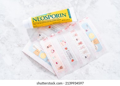 Denver, Colorado, USA-December 29, 2020 - Bandaids And Neosporin To Help With Kids Cuts On The Counter.