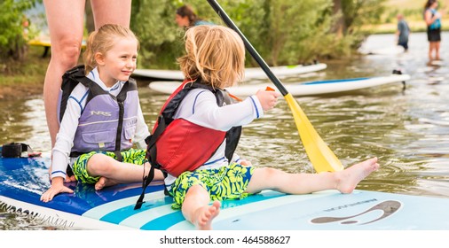 Denver, Colorado, USA-July 23, 2016. Recreational Paddleboarding On Small Pond.