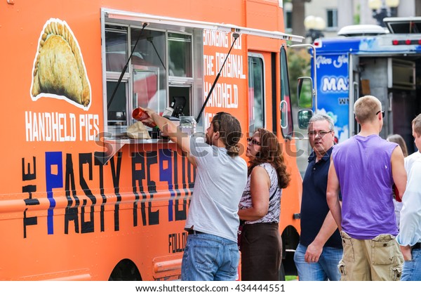 Denver, Colorado, USA-June 11, 2015.  Gathering of gourmet food trucks and carts in Downtown Denver Civic Center Park.