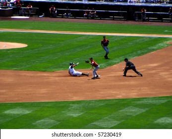 DENVER - JUNE 29: Aaron Miles of the Colorado Rockies slides safely into second base in a game at Coors Field against the Houston Astros June 29, 2005 in Denver, Colorado