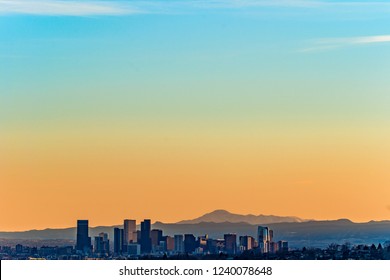 Denver skyline and mountains view at sunset