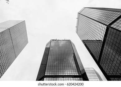 DENVER, USA - MAY 25, 2016: Looking Up Skyscrapers Of The World Trade Center Denver, One Of Them With A Keybank Sign. The Picture Is In Monochrome.