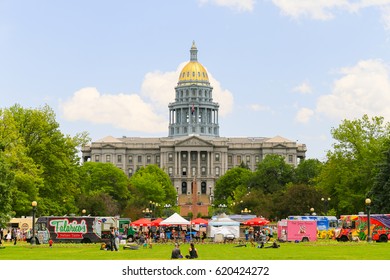 DENVER, USA - MAY 25, 2016: The Colorado State Capitol Seen From The Civic Center Park With Food Trucks In Front And People Sitting On The Lawn.