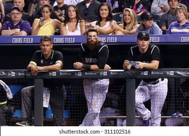 DENVER-AUG 21: Colorado Rockies outfielder Charlie Blackmon (C) in the dugout during a game against the New York Mets at Coors Field on August 21, 2015 in Denver, Colorado.