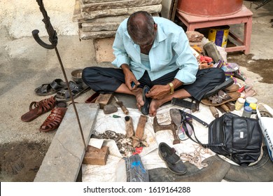 cobbler mending shoes