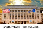 Department of Agriculture office building, American flag flapping, in Washington DC, United States