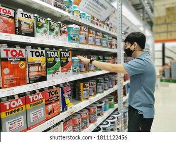 At Department Store In Rayong,Thailand 05 Sep,2020.A Man Wear Black Mask Choosing Buy Home Paint On Shelf For Decorate Room In His House.