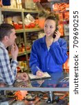 department store seller assisting customer buying