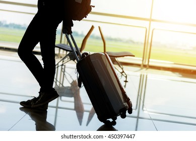 Departure Lounge At The Airport With Traveller And Luggage