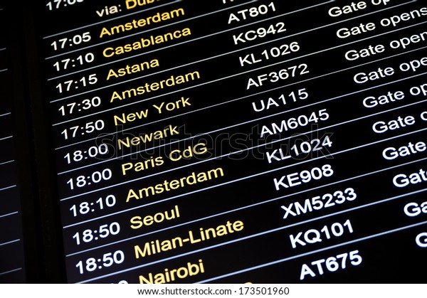 Departures display\
board at airport terminal showing international destinations\
flights to some of the world\'s most popular cities. Business or\
leisure travel\
concept