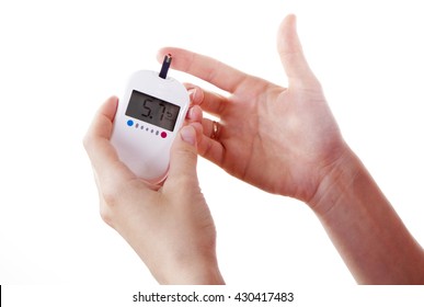 Dependent first type Diabetes patient measuring glucose level blood test using ultra mini glucometer and small drop of blood from finger and test strips isolated on a white background