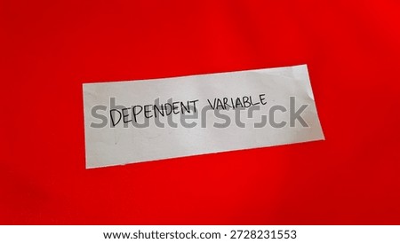 Dependent variable writing on a red background 