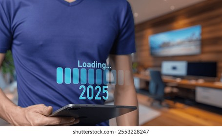 depicts a user interacting with a tablet showcasing a loading progress bar labeled 2025 symbolizing future technology and digital innovation in a modern workspace Progresstransition  2024 to 2025 