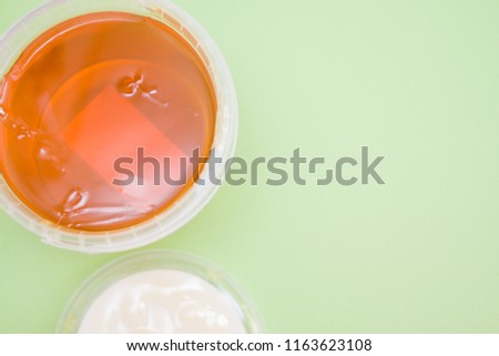 depilation and beauty concept - sugar paste or wax honey for hair removing,