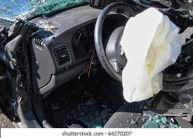 Deployed Crash Safety Air Bag In A Heavily Damaged Wrecked Car After A Violent Traffic Accident