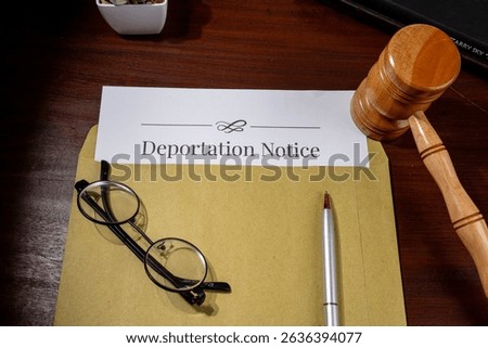 Deportation Notice Document on Table with Gavel, Pen, and Eyeglasses – Immigration Law Concept