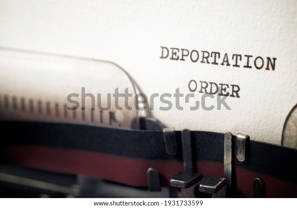 Deportation order\
phrase written with a\
typewriter.