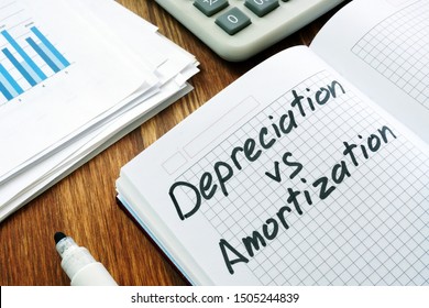 Depreciation and amortization sign in a notebook.